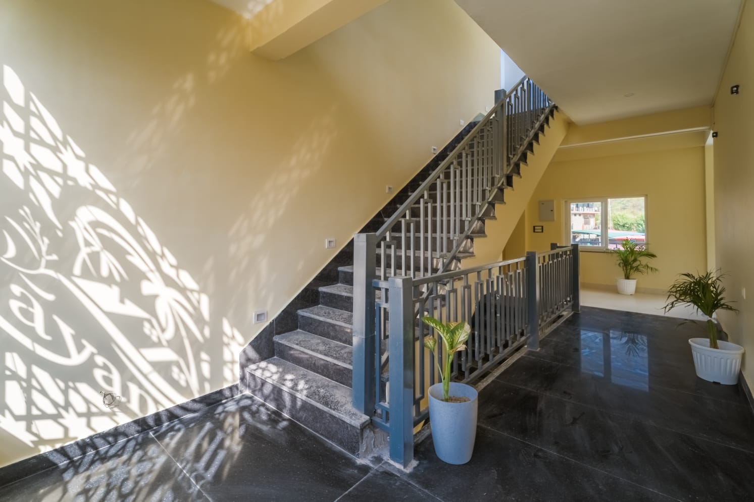 Well-lit stairway and lobby area
